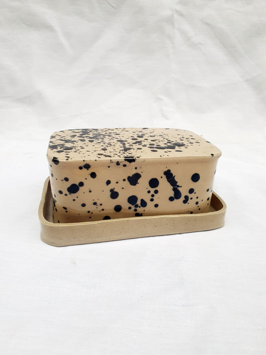 Beurrier beige et noir à tâches socle beige